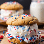 Patriotic ice cream sandwich made with vanilla ice cream and star sprinkles between chewy cookies.