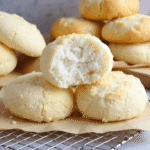 Soft and fluffy cottage cheese cloud bread with a light, airy center and golden edges on parchment paper.